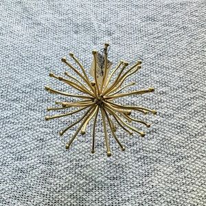 Three Hands gold orb decor